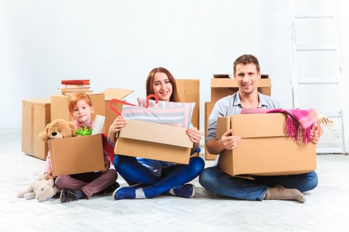 Local removal team loading furniture for a move in west London