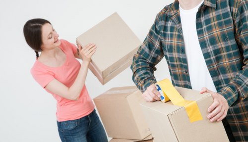 Worker assessing access and handling a removal item
