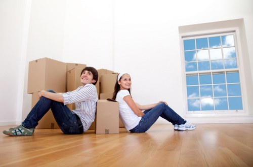 Removal van and moving team in a Hounslow residential street