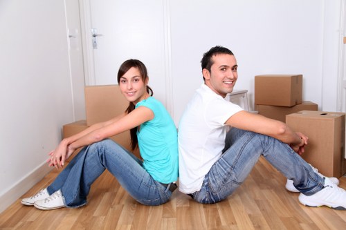 Trained removal staff handling furniture with care
