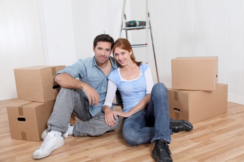 Movers using PPE and safe lifting practices