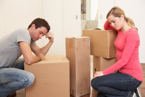 Movers loading furniture into a van in Hounslow