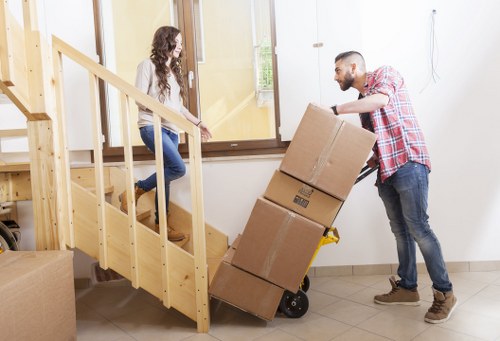 Local moving van helping with furniture transport in West London