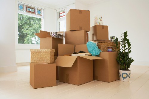 Removal team carrying furniture during a local Hounslow house move