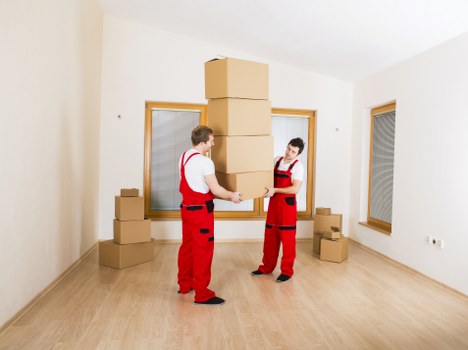 Packed office furniture and boxes ready for relocation