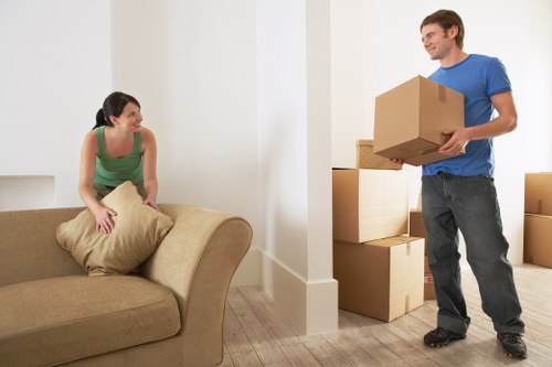 Moving team handling boxes and furniture for a Hounslow home relocation